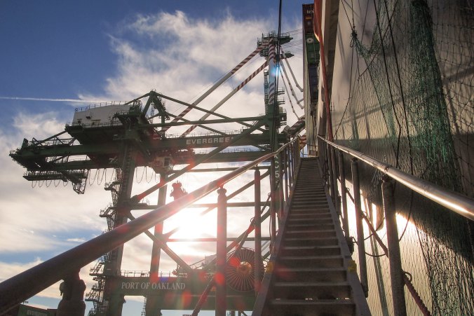 The steep metal gangway leading to the ship’s deck.